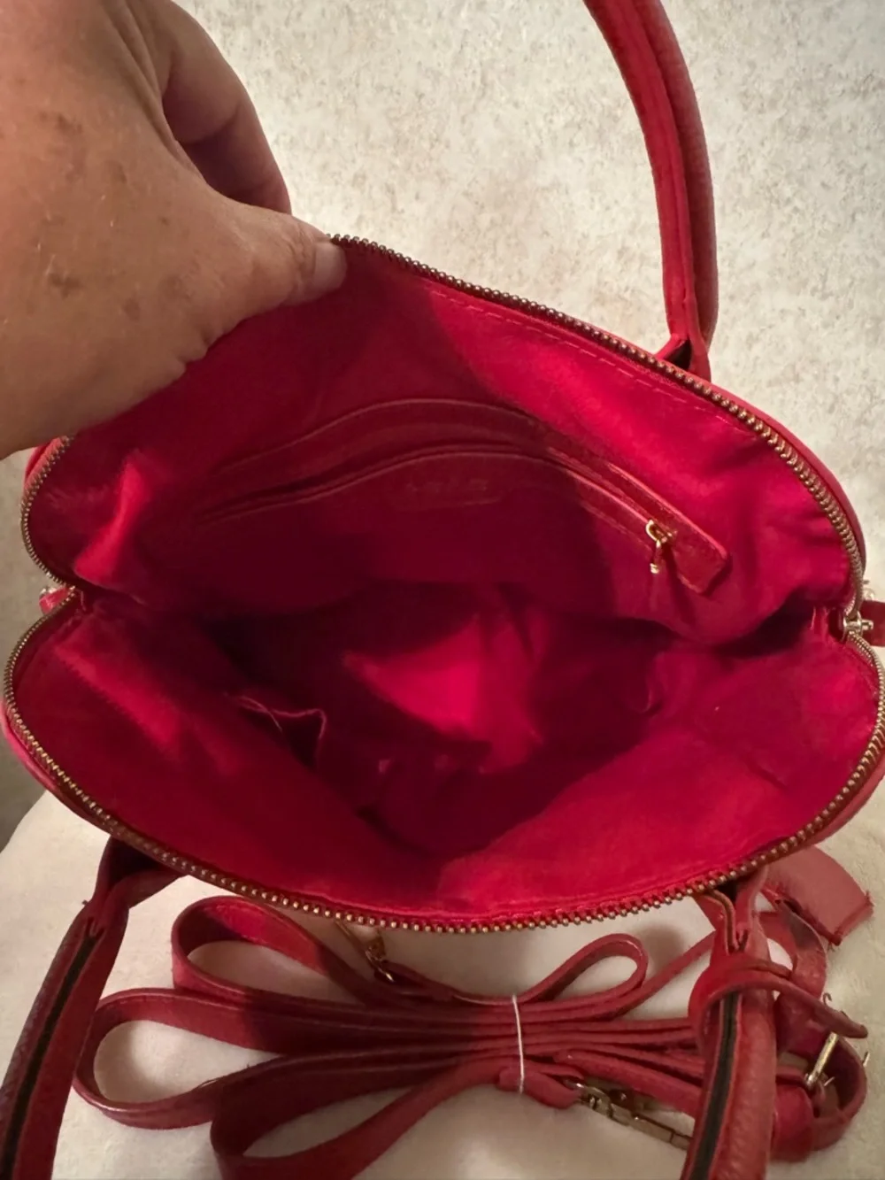 bebe Red Pebbled Fabiola Leather Satchel with Gold Logo Accent with strap.